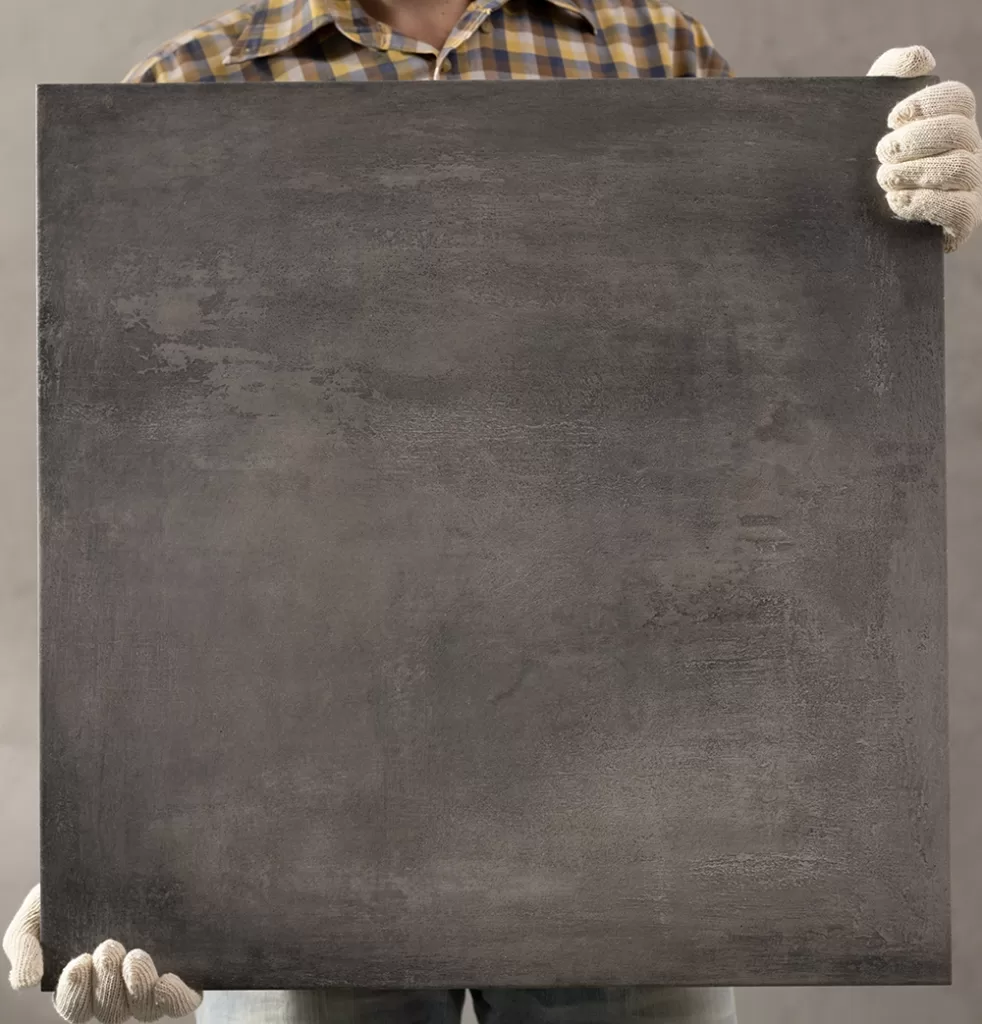 Person holding an old chalkboard ready for removal by Haulin Ass Junk Removal