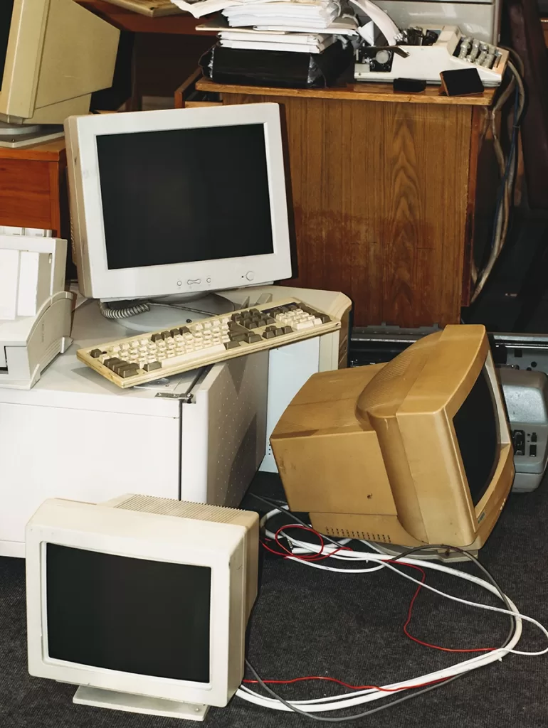 Old computer monitors and keyboard collected for electronics removal and recycling by Haulin Ass Junk Removal