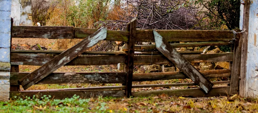 Old wooden fence and gate being removed in Canton, GA
