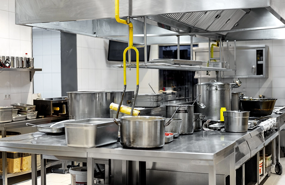 Commercial kitchen with restaurant equipment ready for removal by Haulin Ass Junk Removal