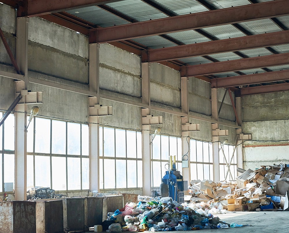 Cluttered warehouse with junk items ready for removal by Haulin Ass Junk Removal